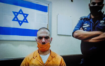 Riad Roshrosh, seen on a screen via a video link during a hearing on his appeal against a manslaughter conviction for the killing of his girlfriend, at the Supreme Court in Jerusalem, on July 2, 2020. (Yonatan Sindel/Flash90)
