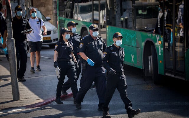 Police officers patrol in the ultra orthodox Jewish neighborhood of Mea Shearim, Jerusalem, July 6, 2020 (Yonatan Sindel/Flash90) Police officers patrol in the ultra orthodox Jewish neighborhood of Mea Shearim, Jerusalem, July 6, 2020 (Yonatan Sindel/Flash90)