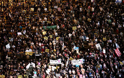 Protesters demand government action at a demonstration in Tel Aviv's Rabin Square against economic policy in the wake of the crisis triggered by the pandemic, on July 11, 2020. (Miriam Alster/ Flash90)