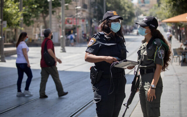Police officers enforce emergency regulations on Jaffa Street in downtown Jerusalem on July 17, 2020 (Yonatan Sindel/Flash90) Police officers enforce emergency regulations on Jaffa Street in downtown Jerusalem on July 17, 2020 (Yonatan Sindel/Flash90)