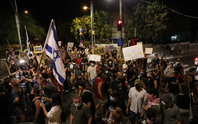 Demonstrators protest against Prime Minister Benjamin Netanyahu outside his residence in Jerusalem on July 18, 2020 (Olivier Fitoussi/Flash90) Demonstrators protest against Prime Minister Benjamin Netanyahu outside his residence in Jerusalem on July 18, 2020 (Olivier Fitoussi/Flash90)