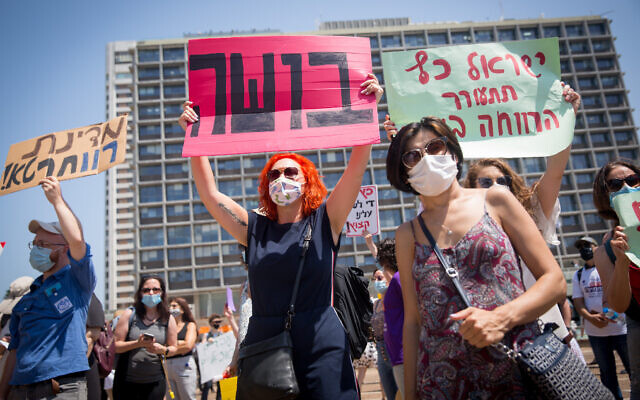 Israeli social workers protest their working conditions in Tel Aviv on July 21, 2020. (Miriam Alster/Flash90) Israeli social workers protest their working conditions in Tel Aviv on July 21, 2020. (Miriam Alster/Flash90)