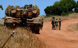 Israel Defense Forces soldiers stationed along the border with Lebanon on July 23, 2020. (Basel Awidat/Flash90)