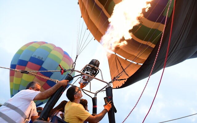 Hot air balloons take off from the Ben Gurion International Airport, near Tel Aviv on July 25, 2020 (Tomer Neuberg/Flash90) Hot air balloons take off from the Ben Gurion International Airport, near Tel Aviv on July 25, 2020 (Tomer Neuberg/Flash90)