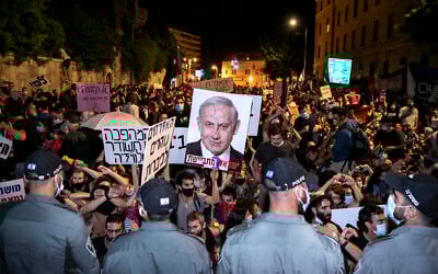 Israelis protest against Prime Minister Benjamin Netanyahu outside the prime minister's official residence in Jerusalem, on July 25, 2020. (Olivier Fitoussi)