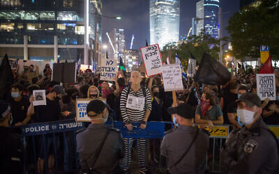 Protesters against Public Security Minister Amir Ohana in Tel Aviv on July 28, 2020. (Miriam Alster/Flash90)