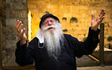 A Jewish man  at the Western Wall in the Old City of Jerusalem, on July 29, 2020. (Olivier Fitoussi/Flash90)