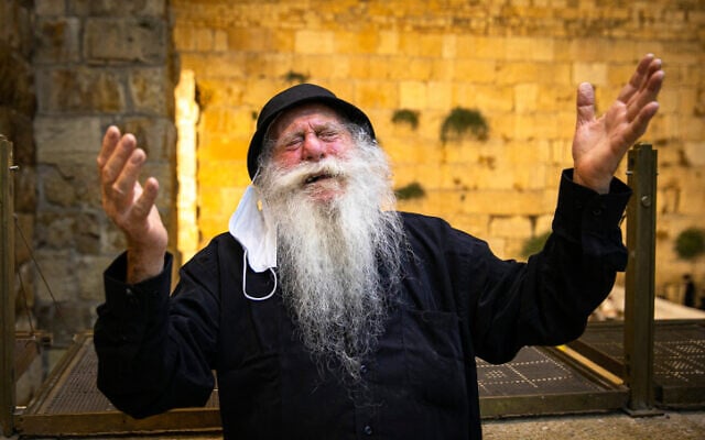 A Jewish man at the Western Wall in the Old City of Jerusalem, on July 29, 2020. (Olivier Fitoussi/Flash90) A Jewish man at the Western Wall in the Old City of Jerusalem, on July 29, 2020. (Olivier Fitoussi/Flash90)