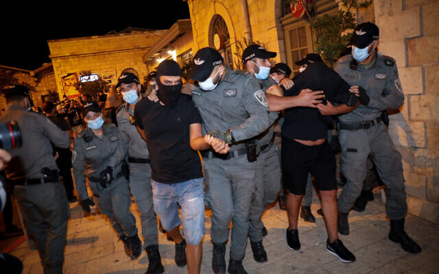 Illustrative: Police arrest La Familia soccer hooligans at the First Station in Jerusalem on July 30, 2020. (Olivier Fitoussi/Flash90) Illustrative: Police arrest La Familia soccer hooligans at the First Station in Jerusalem on July 30, 2020. (Olivier Fitoussi/Flash90)