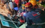 Rescue workers recover the body of a teen who drowned in a cistern near the West Bank settlement of Kedumim on July 2, 2020. (Liran Atias/Fire and Rescue Service)