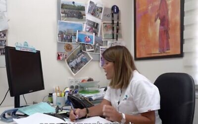 Screen capture from video of a nurse at the Ramle Health Office conducting an epidemiological investigation with a known virus carrier. (Channel 12 news)