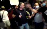 Anti-Netanyahu protesters attack Channel 13 journalist Avishay Ben Haim as he covers a protest calling for the premier's ouster outside of his Jerusalem residence on July 14, 2020. (Screen capture/Twitter)