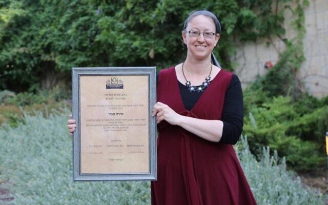 Shira Sapir receives her certification as "morat hora'ah" and spiritual leader from Ohr Torah Stone during a ceremony in Jerusalem, July 5, 2020. (Gershon Ellinson via JTA) Shira Sapir receives her certification as "morat hora'ah" and spiritual leader from Ohr Torah Stone during a ceremony in Jerusalem, July 5, 2020. (Gershon Ellinson via JTA)