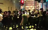Ultra-Orthodox protesters clash with police in Jerusalem over the arrest of a yeshiva student, July 22, 2020. (Screenshot/YouTube)