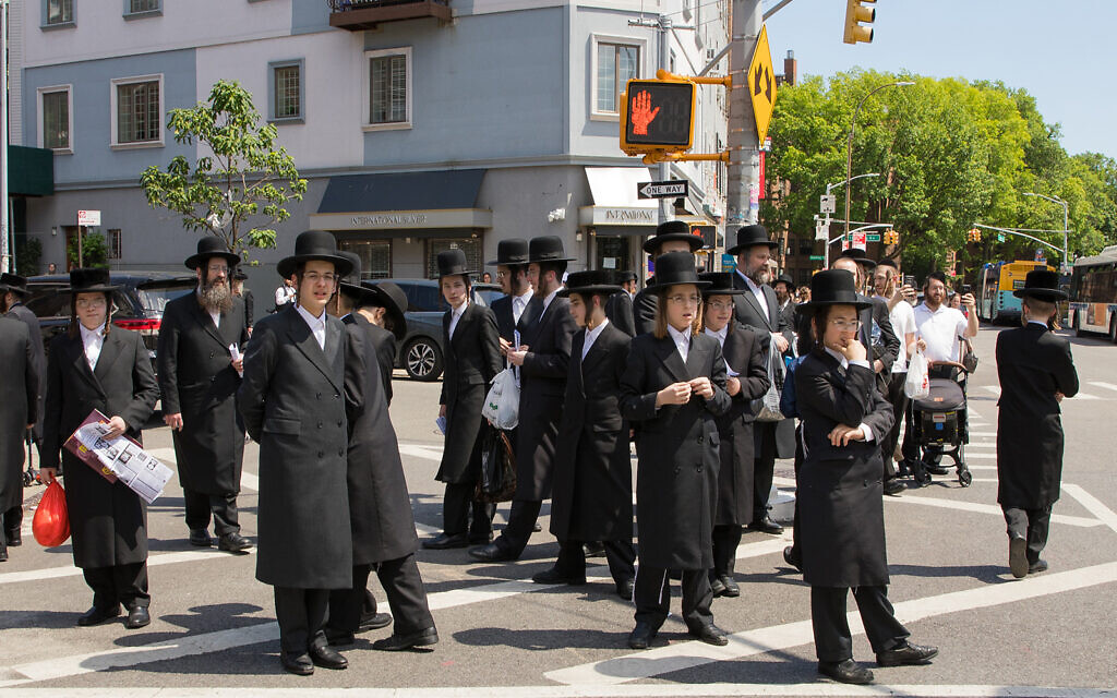 Williamsburg residents look on as protesters pass through their Brooklyn neighborhood, June 12, 2020. (Avi Kaye via JTA) Williamsburg residents look on as protesters pass through their Brooklyn neighborhood, June 12, 2020. (Avi Kaye via JTA)