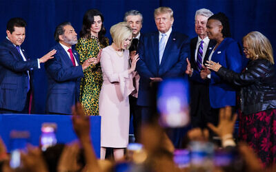 Local religious leaders pray alongside US President Donald Trump at the King Jesus International Ministry during a "Evangelicals for Trump" rally in Miami, Flaorida, January 3, 2020. (Scott McIntyre/For The Washington Post via Getty Images, JTA)