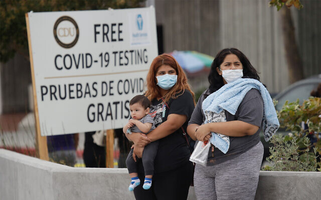 People wait to take a coronavirus test at a mobile testing site in Los Angeles, California, July 22, 2020. (AP Photo/Marcio Jose Sanchez) People wait to take a coronavirus test at a mobile testing site in Los Angeles, California, July 22, 2020. (AP Photo/Marcio Jose Sanchez)