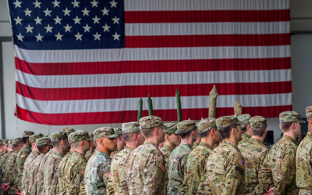 US soldiers stand in formation during a military ceremony at the Storck barracks in Illesheim, Germany, March 9, 2017. (Nicolas Armer/dpa via AP) US soldiers stand in formation during a military ceremony at the Storck barracks in Illesheim, Germany, March 9, 2017. (Nicolas Armer/dpa via AP)