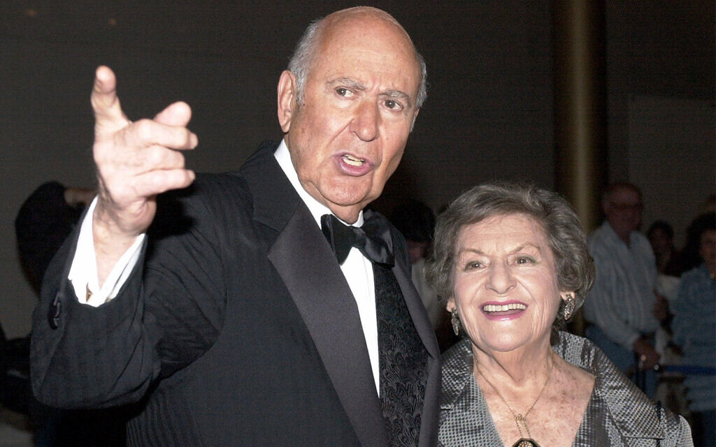 Carl Reiner is accompanied by his wife Estelle as they enter the Kennedy Center in Washington, October 24, 2000. (AP Photo/Stephen J. Boitano, file)