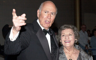 Carl Reiner is accompanied by his wife Estelle as they enter the Kennedy Center in Washington, October 24, 2000. (AP Photo/Stephen J. Boitano, file)