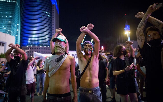 Self-employed Israelis block a road in Tel Aviv, during a protest calling for financial support from the government, July 11, 2020. (Miriam Alster/Flash90) Self-employed Israelis block a road in Tel Aviv, during a protest calling for financial support from the government, July 11, 2020. (Miriam Alster/Flash90)