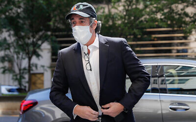 Michael Cohen arrives at his Manhattan apartment in New York after being furloughed from prison because of concerns over the coronavirus, on May 21, 2020. (AP Photo/John Minchillo, File)