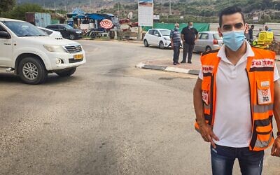 Dr. Muhammad Isa standing near the car in which 4-year old Muhammad Khalil was found. (United Hatzalah)