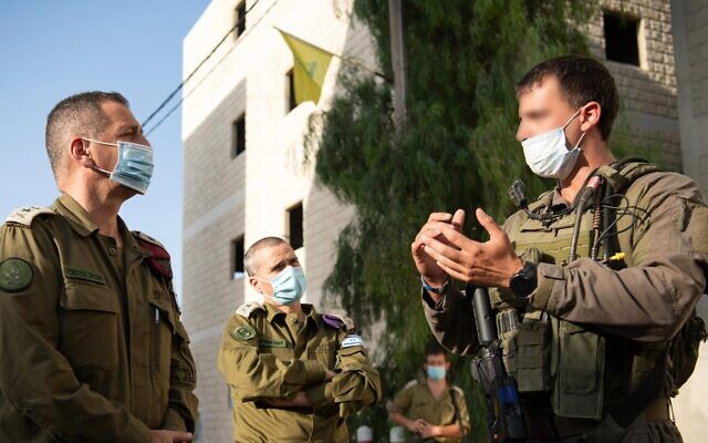 IDF Chief of Staff Aviv Kohavi, left, speaks to soldiers from the IDF's Ghost Unit as they take part in a weeks-long training exercise in July 2020. (Israel Defense Forces)