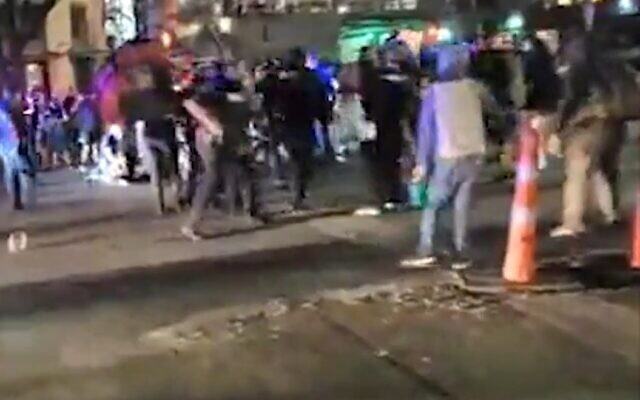 The scene after a protester who was apparently armed with a rifle at a demonstration against police violence was shot and killed after he approached a vehicle that had driven through the crowd and the driver opened fire, July 25, 2020 (Screen grab/abc7) The scene after a protester who was apparently armed with a rifle at a demonstration against police violence was shot and killed after he approached a vehicle that had driven through the crowd and the driver opened fire, July 25, 2020 (Screen grab/abc7)