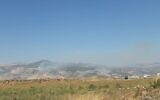Smoke rises from a fire sparked by Israel near the contested Mount Dov area, along the Israel-Lebanon border on July 22, 2020. (Hezbollah media)