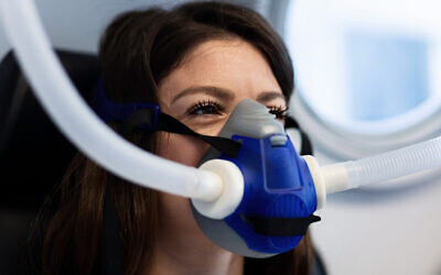 Patient wearing a mask while having hyperbaric oxygen therapy. (iStock)