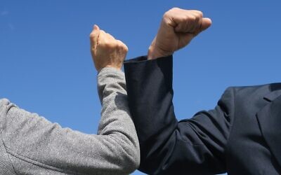 Illustrative image of an elbow-bump (Picturesque Japan; iStock by Getty Images)
