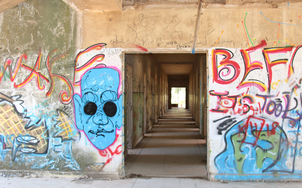 Graffiti in a former Syrian military headquarters in northern Israel which was visited by Eli Cohen as a spy. (Shmuel Bar-Am)