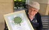 Prof. Sol Green with the certificate from the Keren Kayamet LeIsrael-Jewish National Fund honoring him on his 99th birthday with the planting of 100 trees in his name, July 15, 2020, Jerusalem. (Courtesy)
