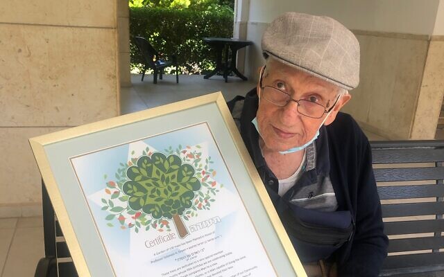 Prof. Sol Green with the certificate from the Keren Kayamet LeIsrael-Jewish National Fund honoring him on his 99th birthday with the planting of 100 trees in his name, July 15, 2020, Jerusalem. (Courtesy) Prof. Sol Green with the certificate from the Keren Kayamet LeIsrael-Jewish National Fund honoring him on his 99th birthday with the planting of 100 trees in his name, July 15, 2020, Jerusalem. (Courtesy)