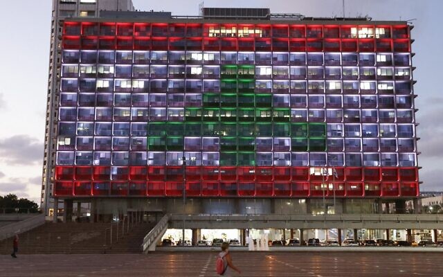 Illustrative: The Tel Aviv city hall is lit up in the colors of the Lebanese flag in solidarity with the victims of the Beirut port explosion, August 5, 2020. (Jack Guez/AFP) Illustrative: The Tel Aviv city hall is lit up in the colors of the Lebanese flag in solidarity with the victims of the Beirut port explosion, August 5, 2020. (Jack Guez/AFP)
