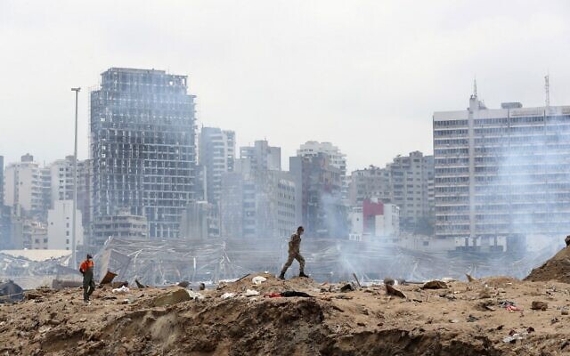 A soldier walks at the site of the massive explosion at the port of Beirut, August 6, 2020. (Thibault Camus/Pool/AFP) A soldier walks at the site of the massive explosion at the port of Beirut, August 6, 2020. (Thibault Camus/Pool/AFP)