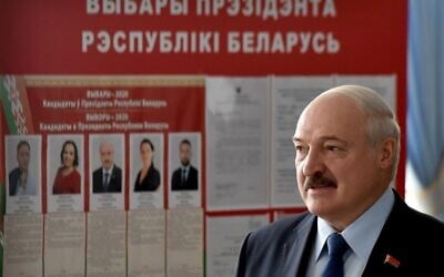 Belarus' President Alexander Lukashenko arrives to vote at a polling station during the presidential election in Minsk on August 9, 2020. (Sergei GAPON / POOL / AFP)