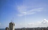 This picture taken in Gaza City on August 10, 2020 shows smoke trails from test rockets fired by the Palestinian terror group Hamas, which currently controls the Gaza Strip, as part of military drills. (Mahmud Hams/AFP)