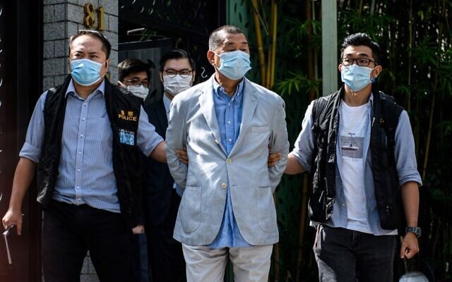 Police lead Hong kong pro-democracy media mogul Jimmy Lai (C) away from his home after he was arrested under the new national security law in Hong Kong on August 10, 2020. (Vernon Yuen/AFP)