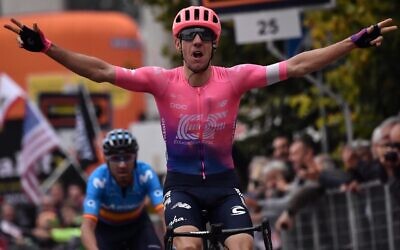 Canada's Michael Woods (EF Education First) celebrates as he crosses the finish line to win the 100th edition of the one-day classic cycling race Milan - Torino between Magenta, west of Milan and Superga, east of Torino, October 9, 2019. (Marco Bertorello / AFP)