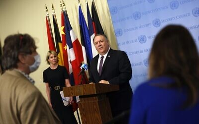 US Secretary of State Mike Pompeo is flanked by US Ambassador to the United Nations Kelly Craft as he speaks to reporters following a meeting with members of the UN Security Council about Iran's alleged non-compliance with a nuclear deal and calling for the restoration of sanctions against Iran at United Nations headquarters in New York, August 20, 2020. (MIKE SEGAR / POOL / AFP)