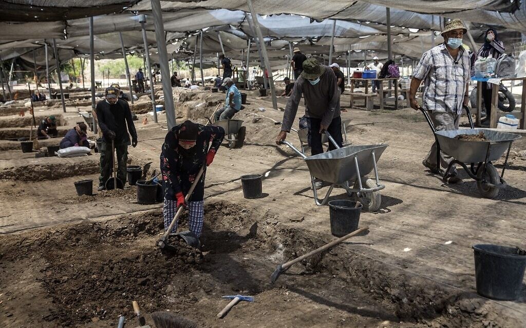 Workers excavate a site where a hoard of gold coins dating to the Abbasid Caliphate was unearthed, at an archeological site near Tel Aviv in central Israel (Heidi Levine / POOL / AFP)