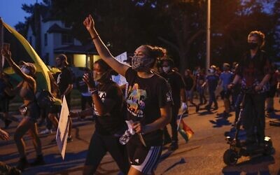 Protesters march during a demonstration against the police shooting of Jacob Blake in Kenosha, Wisconsin, on August 26, 2020. (Kamil Krzaczynski/AFP)