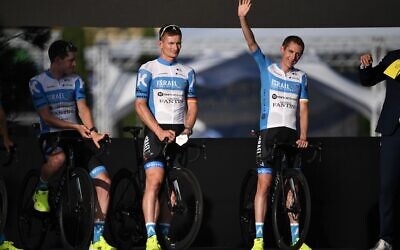 Team Israel Academy rider Ireland's Daniel Martin, right, attends the teams' presentation two days before the start of the 1st stage of the 107th edition of the Tour de France cycling race, in Nice on August 27, 2020. (Anne-Christine POUJOULAT / AFP)