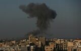 Smoke rises in the distance after IDF planes carried out airstrikes on Hamas targets near Gaza City on August 28, 2020. (MAHMUD HAMS / AFP)