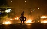 Demonstrators burn tyres during clashes with police in the Rosengard neighbourhood of Malmo, Sweden, on August 28, 2020 ( TT NEWS AGENCY / AFP)