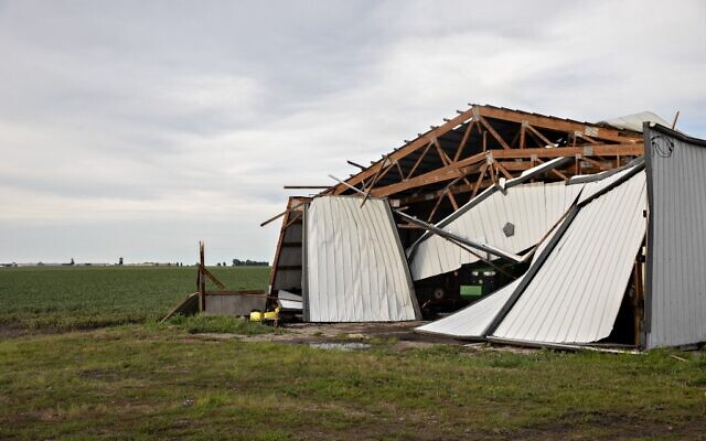 A John Deere agricultural tractor sits under a collapsed building following a derecho storm, a widespread wind storm associated with a band of rapidly moving showers or thunderstorms, on August 10, 2020 near Franklin Grove, Illinois (Daniel Acker/Getty Images/AFP) A John Deere agricultural tractor sits under a collapsed building following a derecho storm, a widespread wind storm associated with a band of rapidly moving showers or thunderstorms, on August 10, 2020 near Franklin Grove, Illinois (Daniel Acker/Getty Images/AFP)