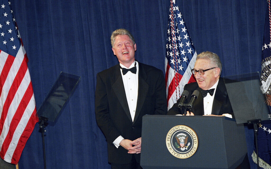Former Secretary of State Henry Kissinger with Bill Clinton, sharing a laugh after then-president Clinton gave the closing remarks at a national policy conference, March 1, 1995. (AP Photo/J. Scott Applewhite)