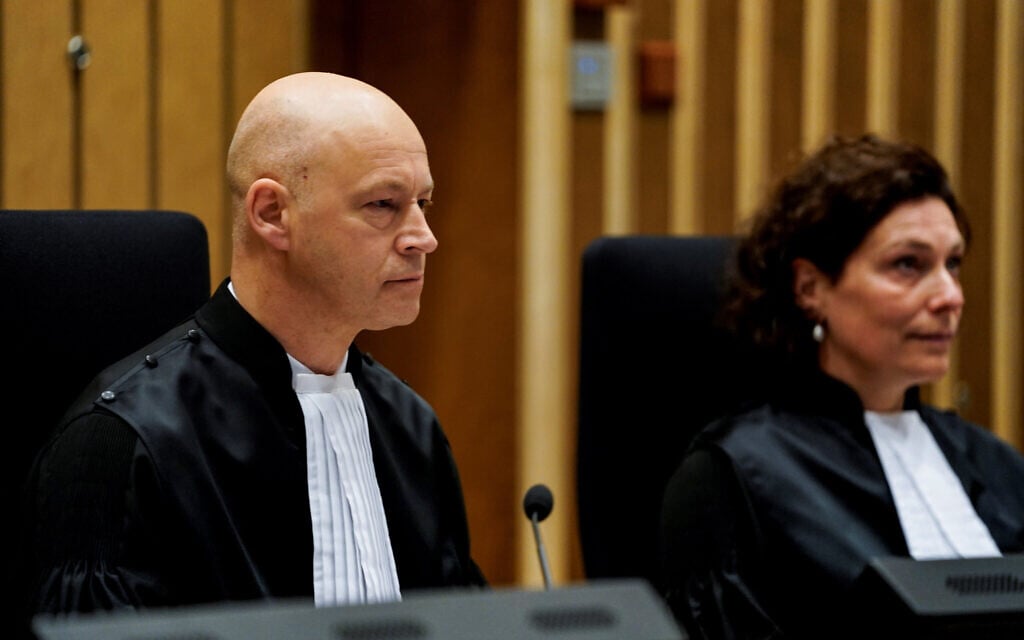 A Dutch judge, Hendrik Steenhuis (L), presides over a hearing at the Schiphol Judicial Court complex in Badhoevedorp, March 9, 2020. (Kenzo Tribouillard/AFP via Getty Images/via JTA) A Dutch judge, Hendrik Steenhuis (L), presides over a hearing at the Schiphol Judicial Court complex in Badhoevedorp, March 9, 2020. (Kenzo Tribouillard/AFP via Getty Images/via JTA)